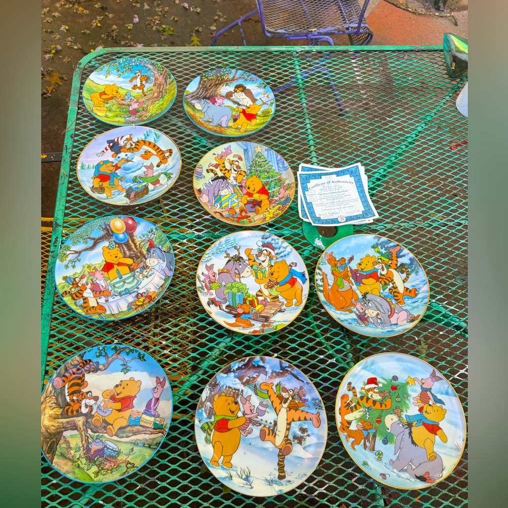 9 collector Winnie the Pooh plates with certificate of authenticity!